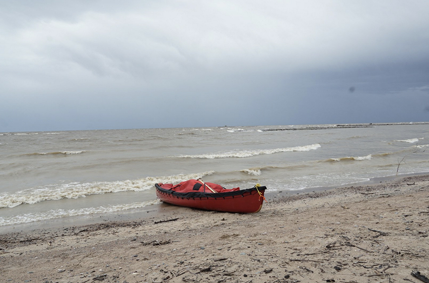 canoe beside big windy lake